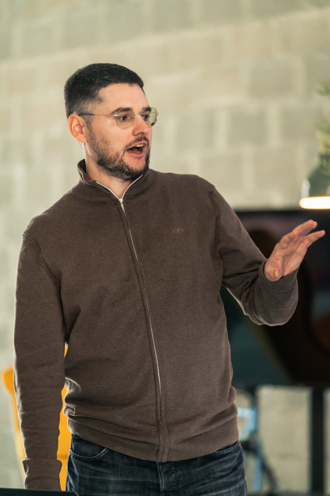 Andrejs presenting at the Cursor Hackathon during Shipyard Day in Riga