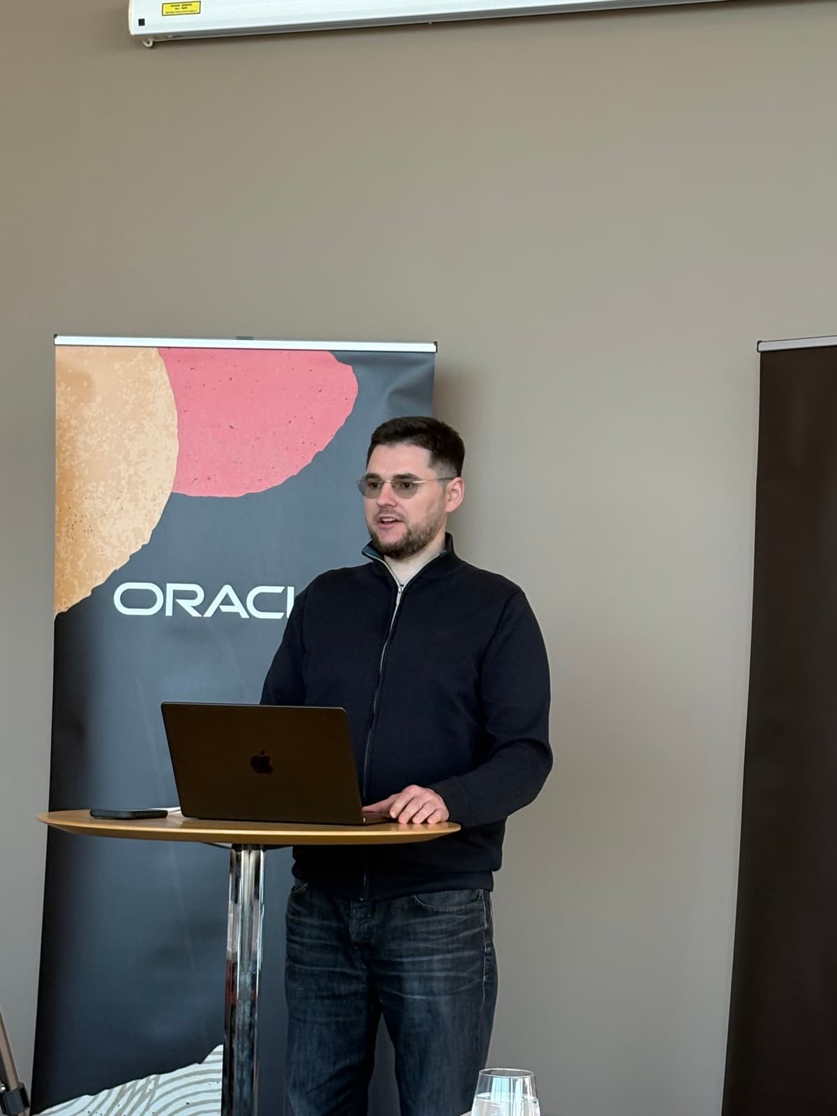 Andrejs presenting at an Oracle community event in Sweden