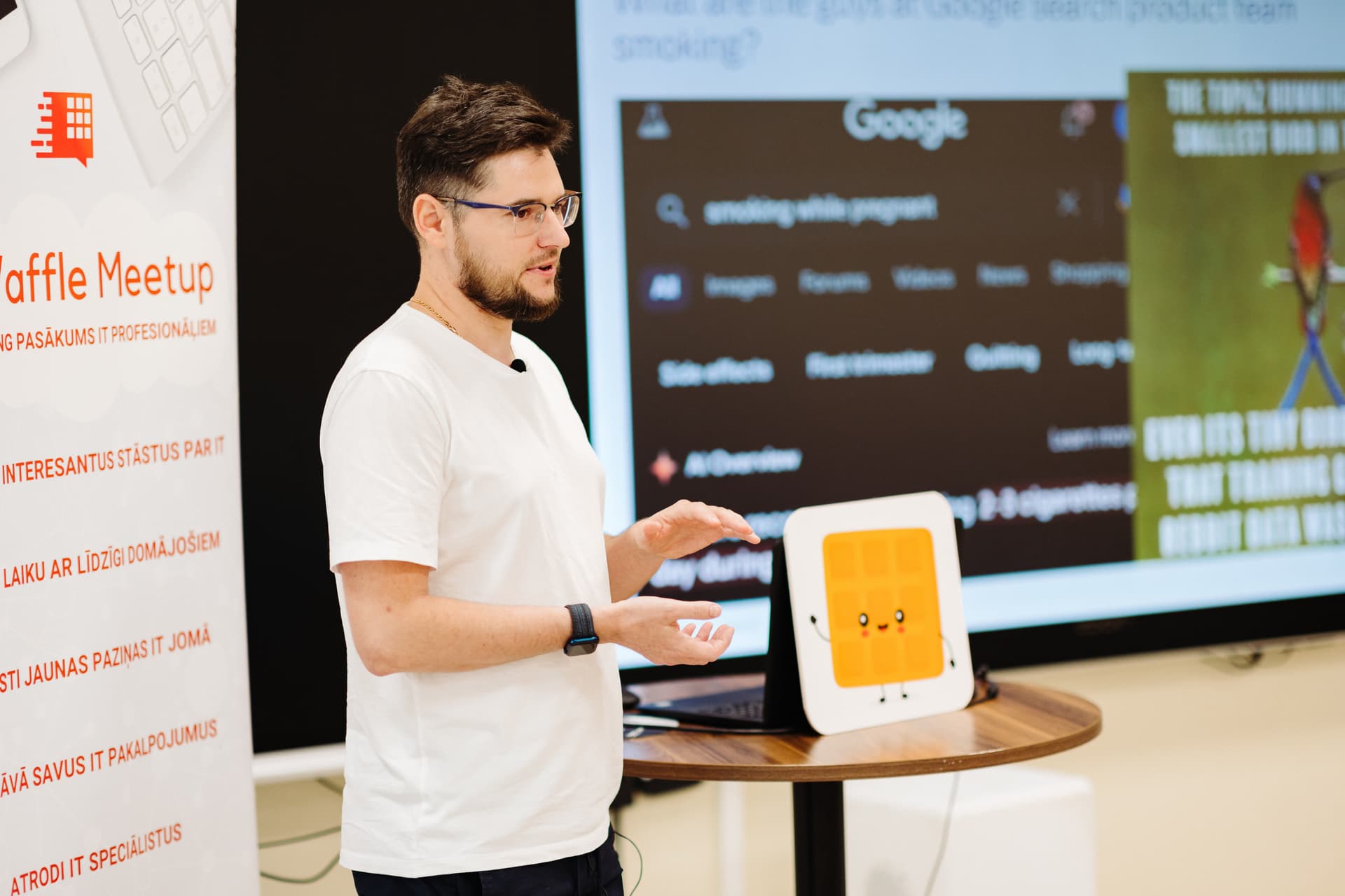 Andrejs in conversation at a meetup